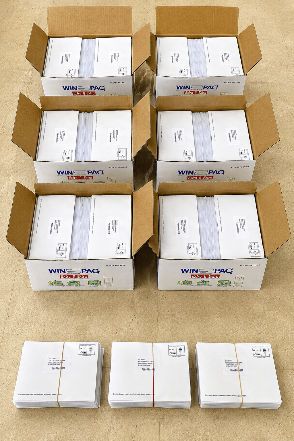 Boxes and bundles of HappiMail flyers packed and ready for distribution